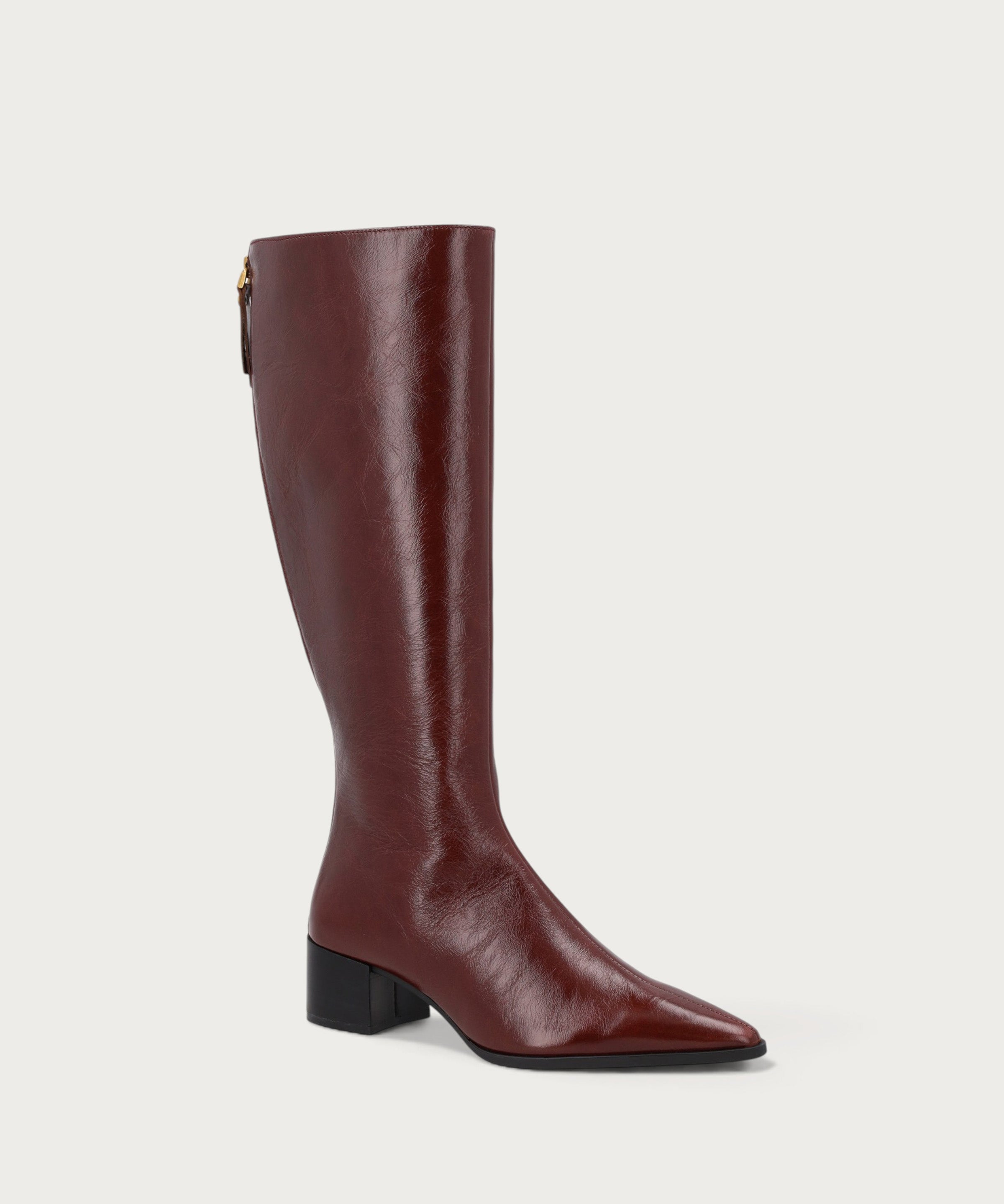 Knee-high heeled boots in burgundy polished leather