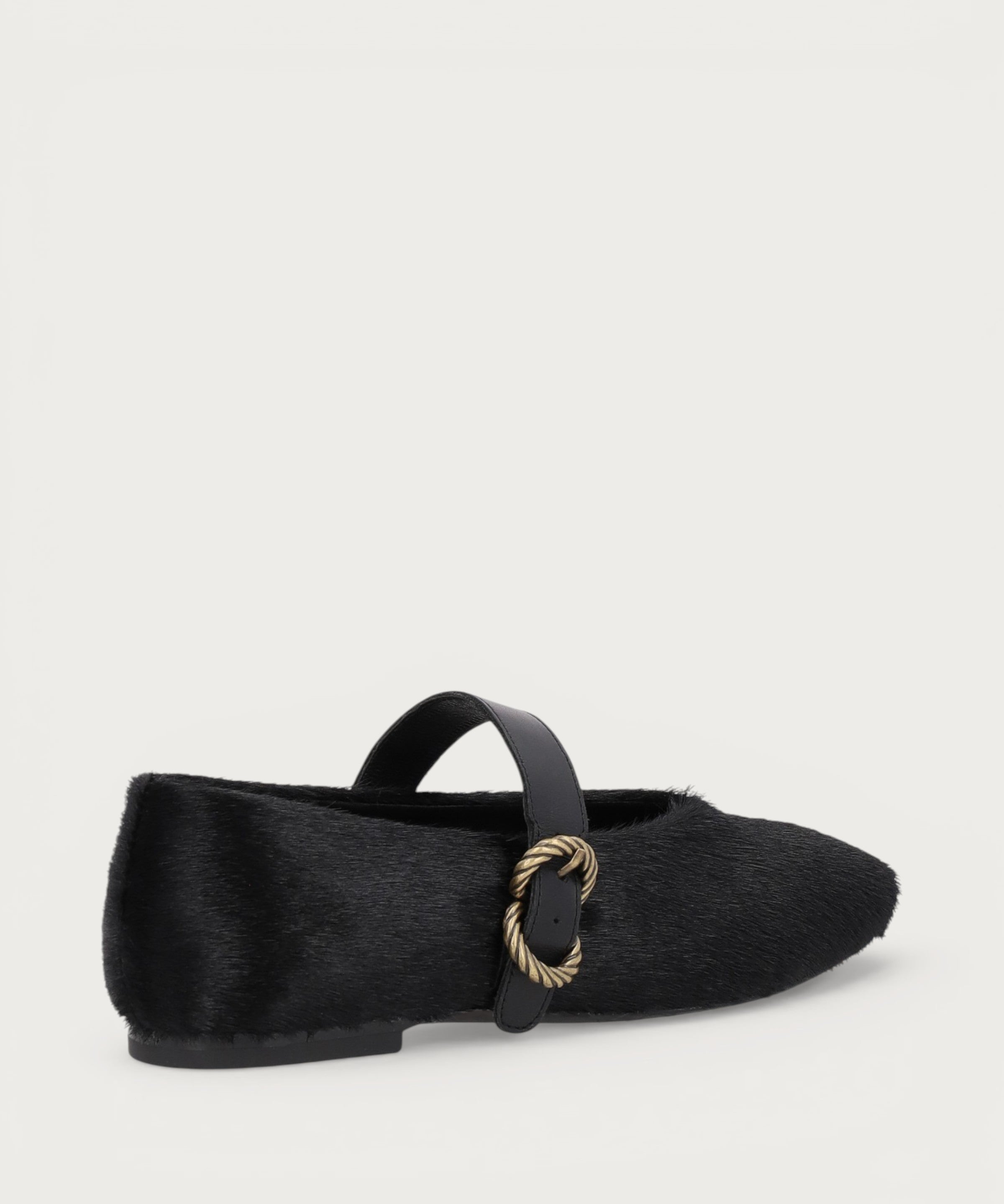 Ballerinas mit Riemchen aus Leder mit Ponyfell-Optik in Schwarz