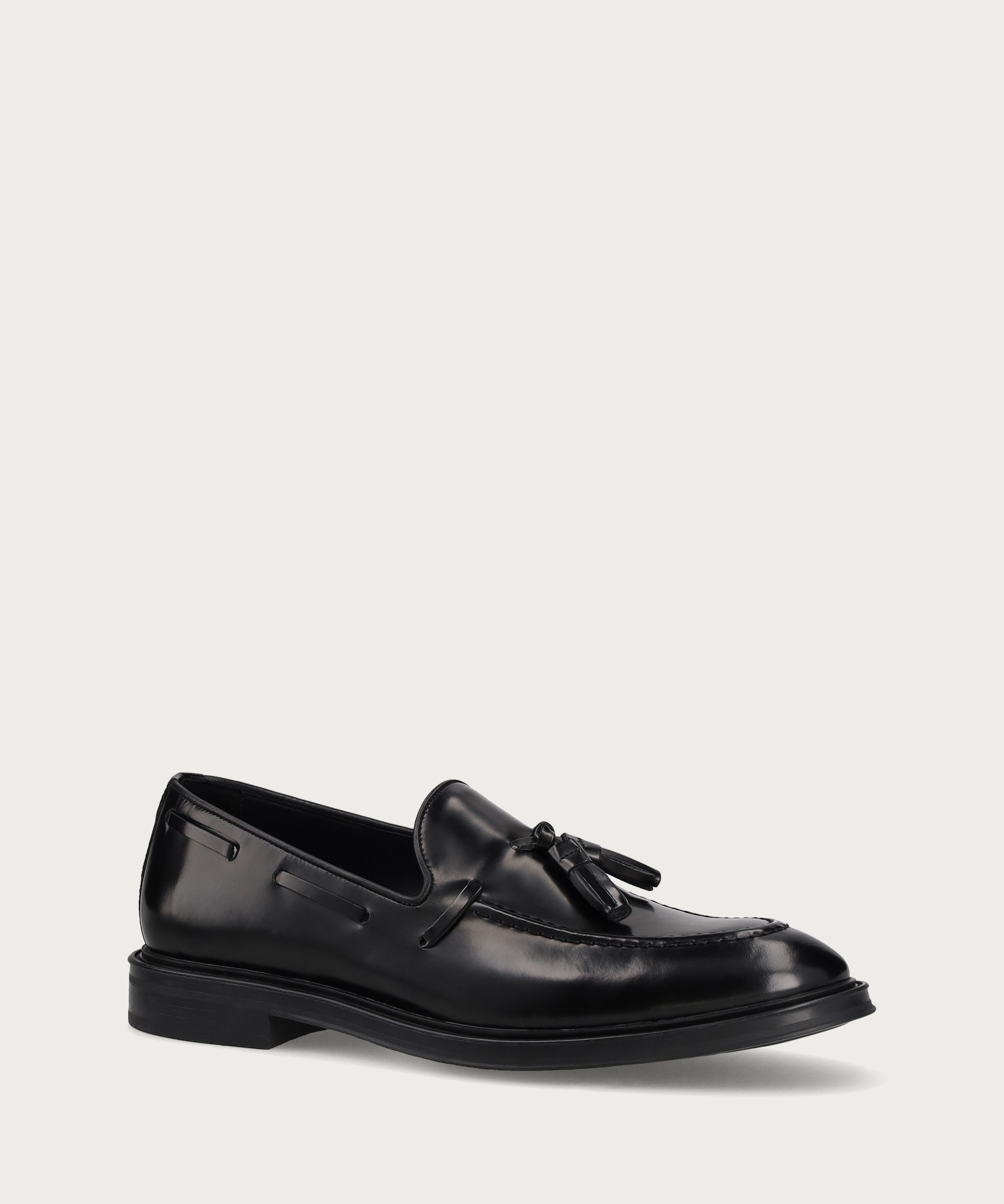 Men's elegant polished black calfskin loafers with tassels