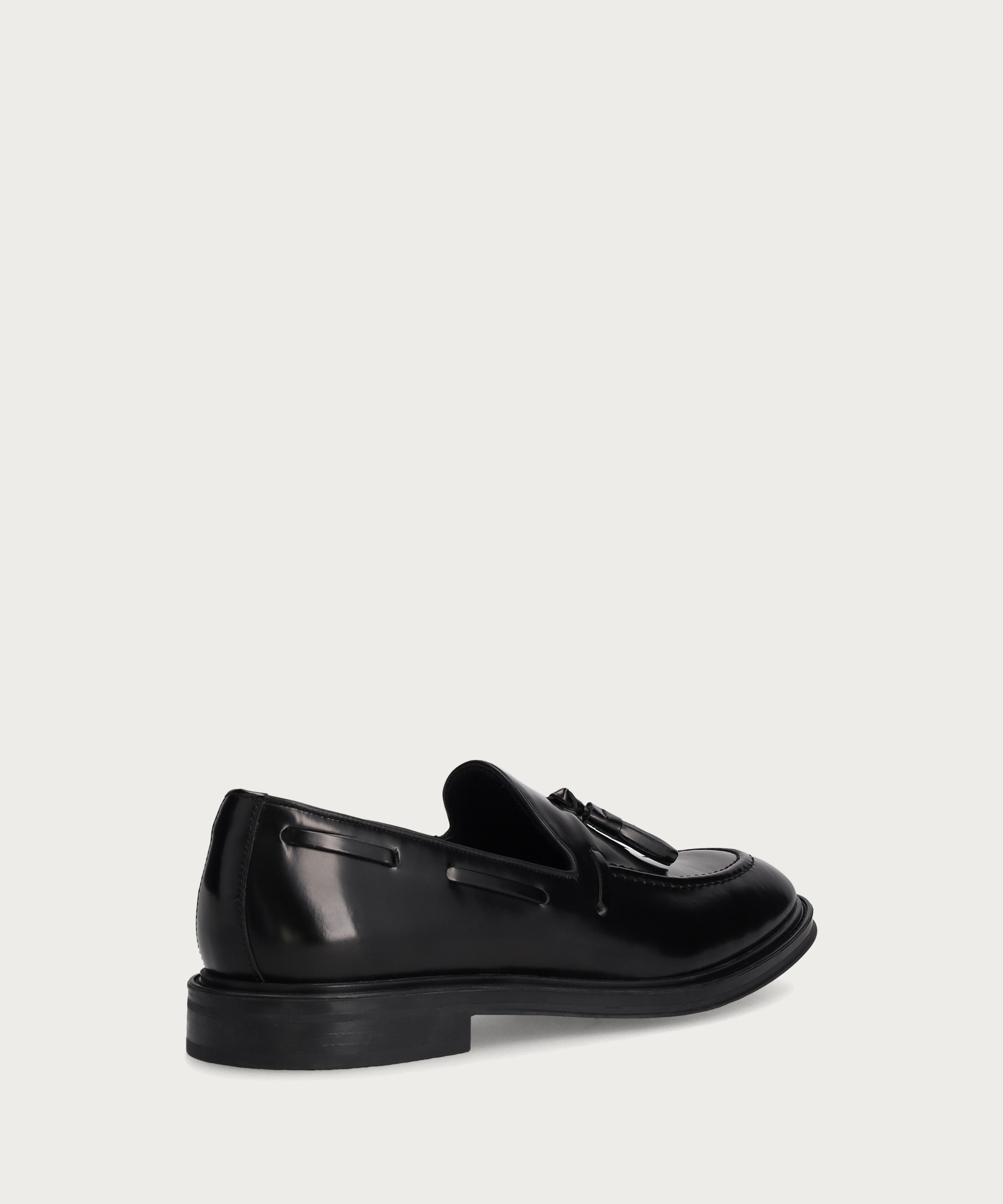 Men's elegant polished black calfskin loafers with tassels