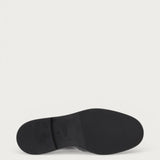 Women's polished black leather loafers with buckle