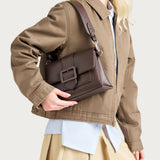 Small shoulder bag in brown synthetic material